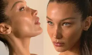 Bella Hadid figura w zbliżeniu, z uwydatnionymi rysami twarzy i delikatnym makijażem.