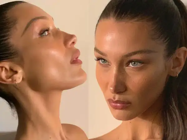 Bella Hadid figura w zbliżeniu, z uwydatnionymi rysami twarzy i delikatnym makijażem.